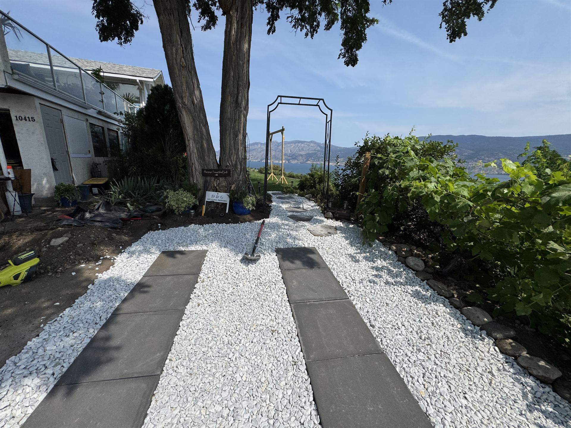 Finished gravel and paver walkway leading to a garden arbour overlooking Okanagan Lake